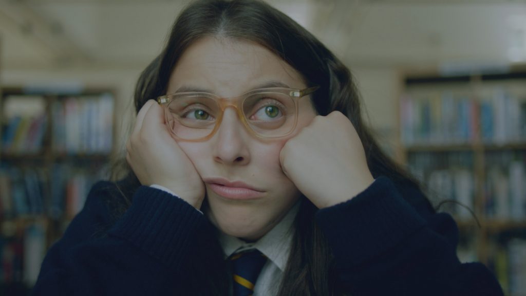 Beanie Feldstein as “Johanna Morrigan” in Coky Giedroyc’s HOW TO BUILD A GIRL. Courtesy of IFC Films. An IFC Films Release.