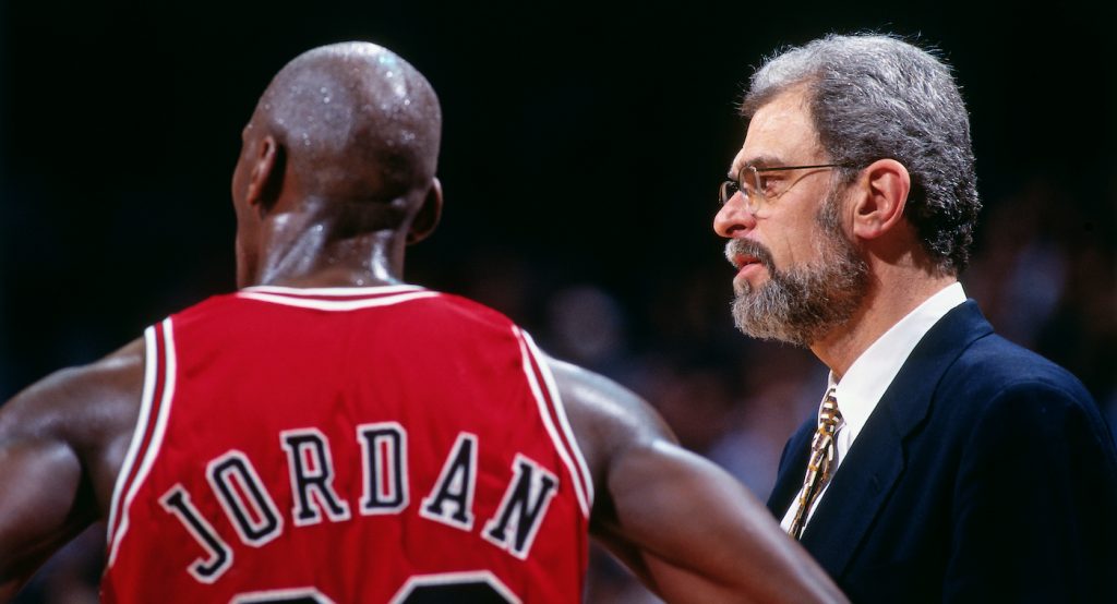 MIAMI - APRIL 2: Michael Jordan #23 and Phil Jackson of the Chicago Bulls look on against the Miami Heat on April 2, 1996 at Miami Arena in Miami, Florida. Andrew D. Bernstein/NBAE via Getty Images)