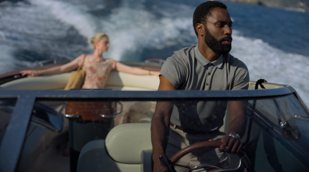 Caption: (L-r) ELIZABETH DEBICKI and JOHN DAVID WASHINGTON in Warner Bros. Pictures’ action epic "TENET," a Warner Bros. Pictures release. Photo Credit: Courtesy of Warner Bros. Pictures