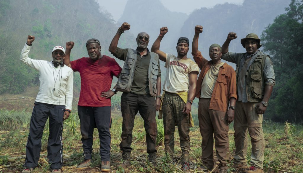 DA 5 BLOODS (L to R) Director SPIKE LEE, ISIAH WHITLOCK JR. as MELVIN, DELROY LINDO as PAUL, JONATHAN MAJORS as DAVID, CLARKE PETERS as OTIS and NORM LEWIS as EDDIE of DA 5 BLOODS Cr. DAVID LEE/NETFLIX © 2020