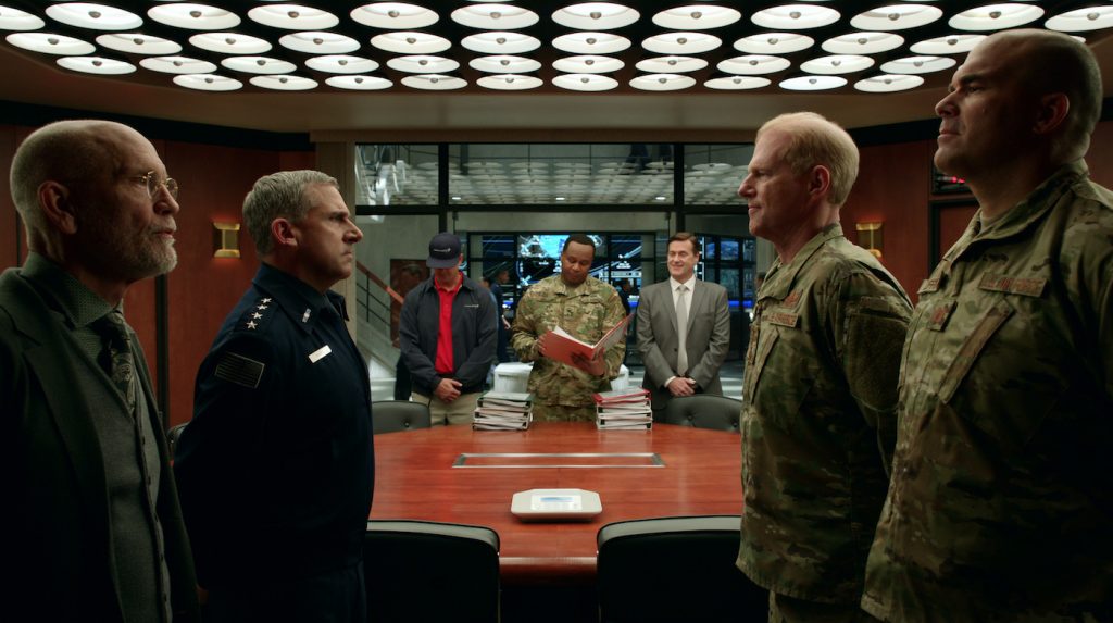 SPACE FORCE (L TO R) JOHN MALKOVICH as DR. ADRIAN MALLORY, STEVE CARELL as GENERAL MARK R. NAIRD, ALEX QUIJANO as STEVEN HINES, ROY WOOD, JR. as ARMY LIAISON BERT MELLOWS, JOHN HARTMANN as CHAMBERS, NOAH EMMERICH as KICK GRABASTON, and BRANDON MOLALE as CLARKE LUFFINCH in episode 105 of SPACE FORCE Cr. Courtesy of Netflix © 2020