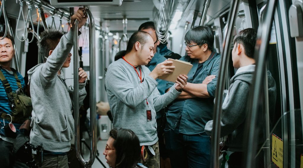 JD Chau (at right, arms crossed) on the set of 'Circle Line.' Courtesy Joan Foo.