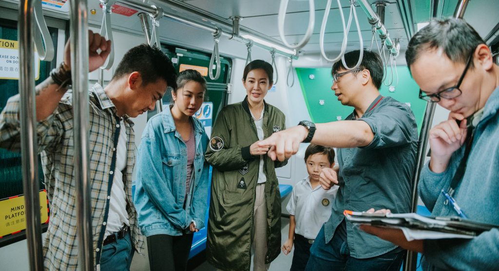 JD Chau (at right, pointing) on the set of 'Circle Line.' Courtesy Joan Foo.