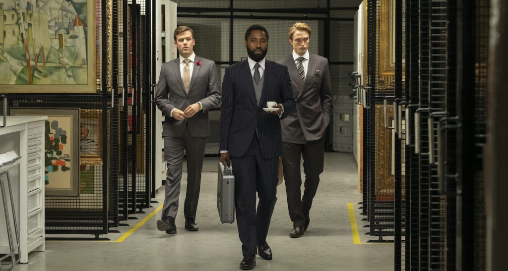 Caption: (L-r) JACK CUTMORE-SCOTT, JOHN DAVID WASHINGTON and ROBERT PATTINSON in Warner Bros. Pictures’ action epic 