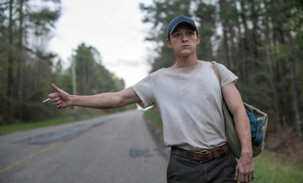 The Devil All The Time (L-R) Bill Skarsgård as Willard Russell, Michael Banks Repeta as Arvin Russell (9 Years Old). Photo Cr. Glen Wilson/Netflix © 2020