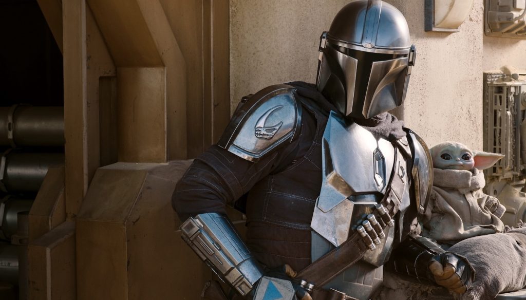 The Mandalorian (Pedro Pascal) and the Child in The Mandalorian, season two. Courtesy Lucasfilm.