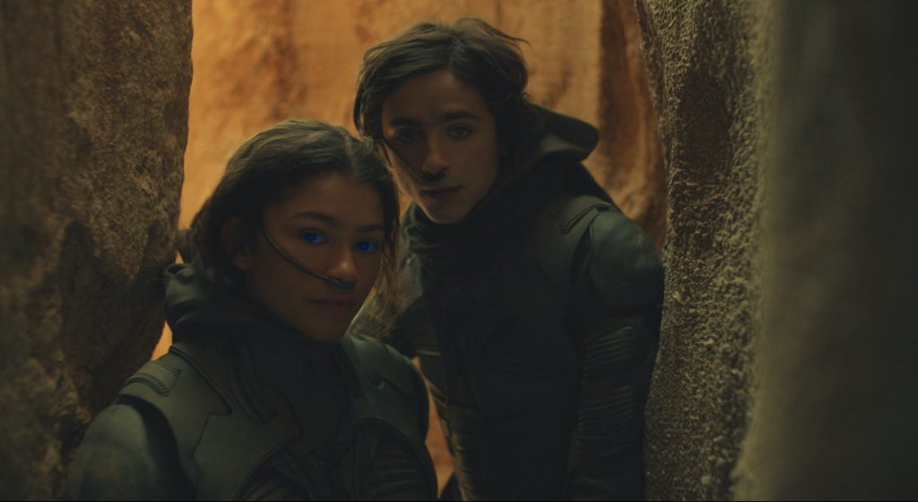 Caption: (L-r) ZENDAYA as Chani and TIMOTHÉE CHALAMET as Paul Atreides in Warner Bros. Pictures’ and Legendary Pictures’ action adventure “DUNE,” a Warner Bros. Pictures and Legendary release. Photo Credit: Courtesy of Warner Bros. Pictures and Legendary PicturesCaption: (L-r) ZENDAYA as Chani and TIMOTHÉE CHALAMET as Paul Atreides in Warner Bros. Pictures’ and Legendary Pictures’ action adventure “DUNE,” a Warner Bros. Pictures and Legendary release. Photo Credit: Courtesy of Warner Bros. Pictures and Legendary Pictures