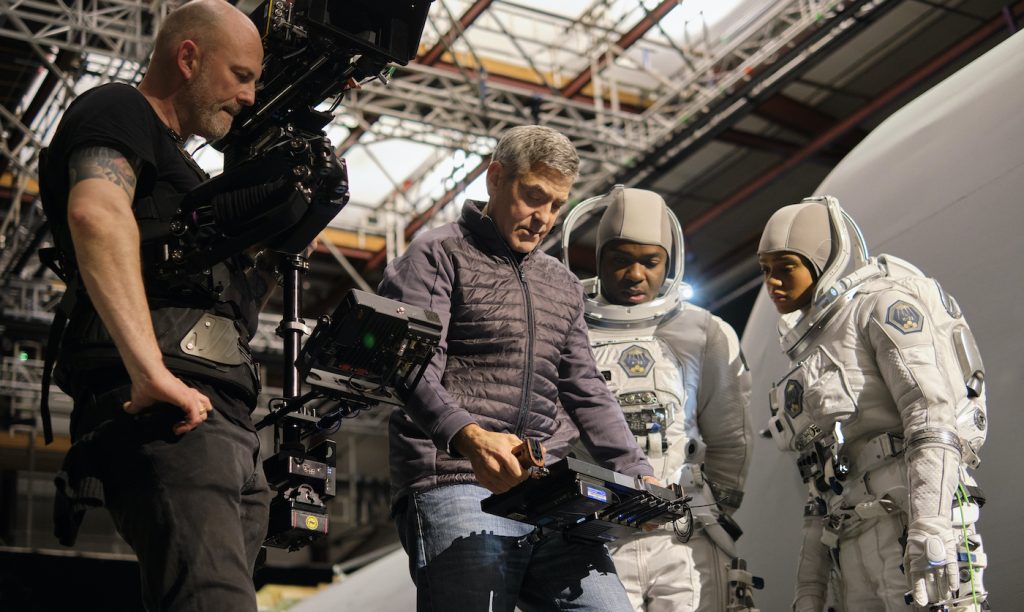 THE MIDNIGHT SKY (2020): Director George Clooney on set at Shepperton Studios with David Oyelowo and Tiffany Boone on the set of The Midnight Sky. Cr. Philippe Antonello/NETFLIX ©2020