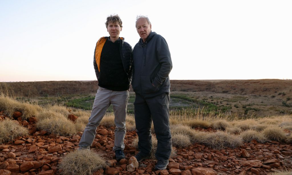 Clive Oppenheimer and Werner Herzog behind the scenes of “Fireball: Visitors From Darker Worlds,” premiering globally on Apple TV+ on November 13.