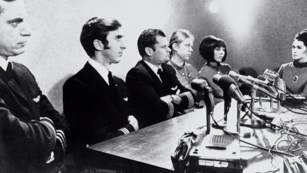 The crew of the hijacked plane, (from left) Second Officer Harold 'Andy' Anderson, Co-Pilot William Rataczak, Pilot William Scott, Stewardesses Tina Mucklow, Florence Schaffner and Alice Hancock. Photograph by Courtesy of HBO
