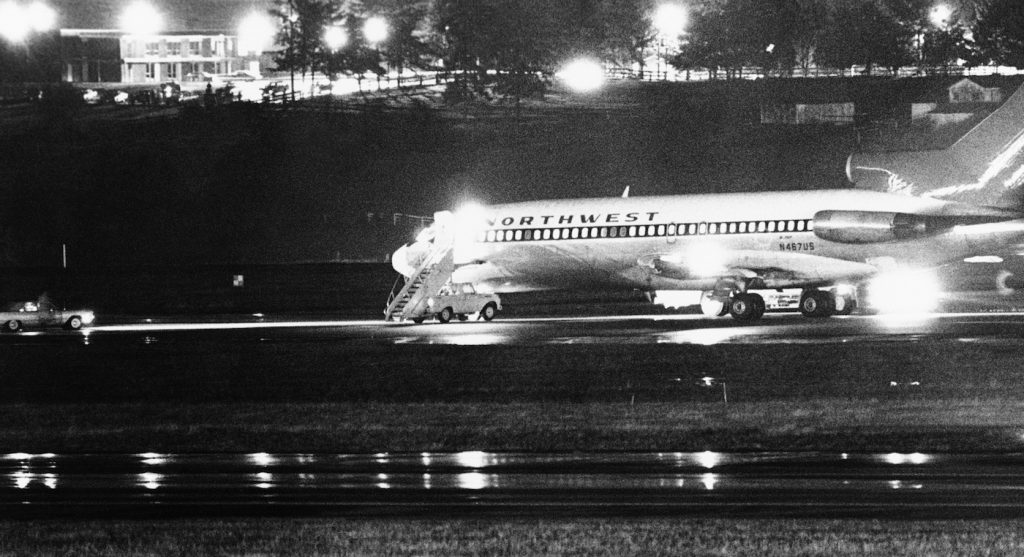 A hijacked Northwest Airlines jetliner 727 sits on a runway for refueling at Tacoma International Airport, Nov. 25, 1971, Seattle, Wash. (AP Photo)