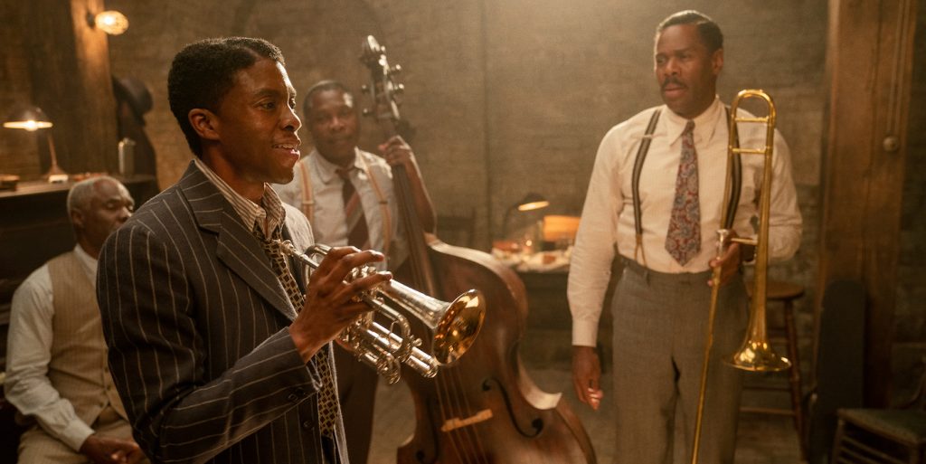 Ma Rainey's Black Bottom (2020): (L to R) Glynn Turman as Toldeo, Chadwick Boseman as Levee, Michael Potts as Slow Drag, and Colman Domingo as Cutler. Cr. David Lee / Netflix