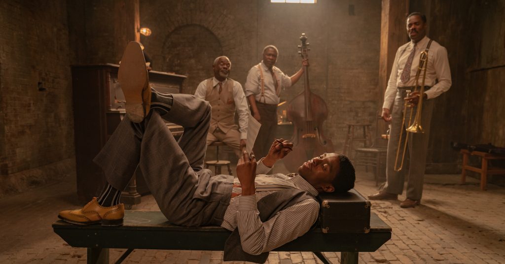 Ma Rainey's Black Bottom (2020): (L to R) Chadwick Boseman as Levee, Glynn Turman as Toldeo, Michael Potts as Slow Drag, Colman Domingo as Cutler. Cr. David Lee / Netflix