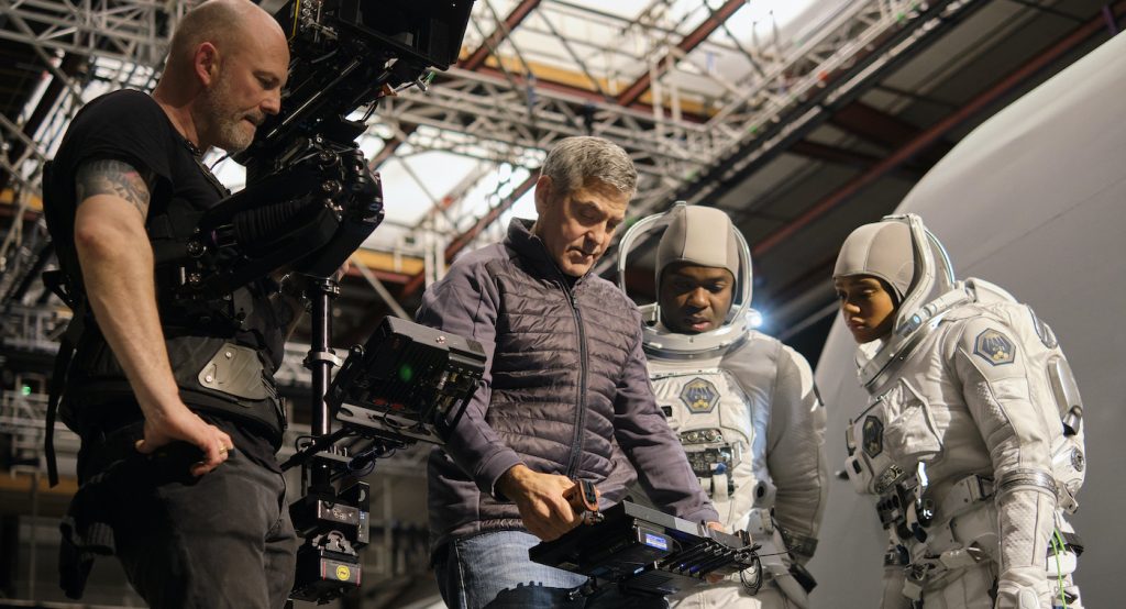 THE MIDNIGHT SKY (2020) Director George Clooney on set at Shepperton Studios with David Oyelowo and Tiffany Boone on the set of The Midnight Sky. Cr. Philippe Antonello/NETFLIX ©2020