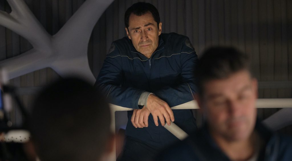 THE MIDNIGHT SKY (2020): Demian Bichir as Sanchez and Kyle Chandler as Mitchell. Cr. Philippe Antonello/NETFLIX