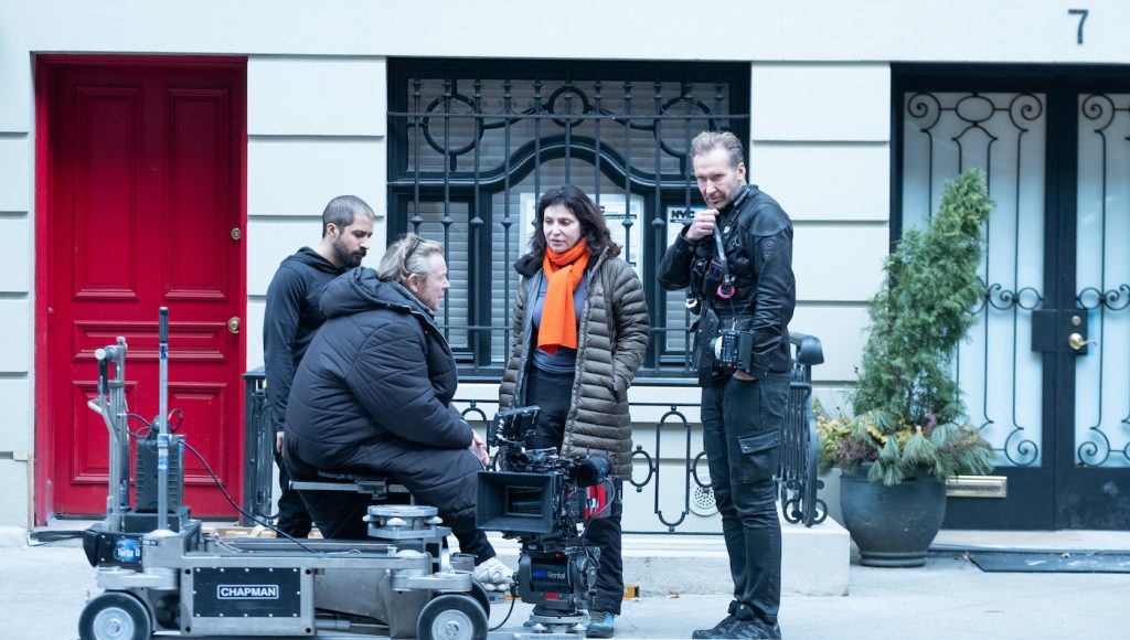 DP Anthony Dod Mantle (seated on dolly) talking with director Susanne Bier, with 1st AC Nino Nueboeck at right. Photo courtesy HBO.