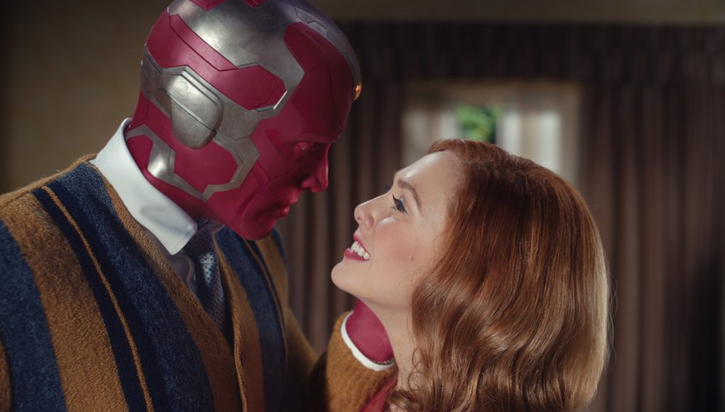 (L-r): Paul Bettany as Vision and Elizabeth Olsen as Wanda Maximoff in Marvel Studios' WandaVision, exclusively on Disney+. Photo courtesy of Marvel Studios.