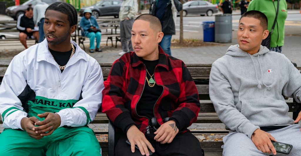 (l-r.) Actor Pop Smoke, director Eddie Huang and actor Taylor Takahashi on the set of their film BOOGIE, a Focus Features release. Credit: Nicole Rivelli / Focus Features