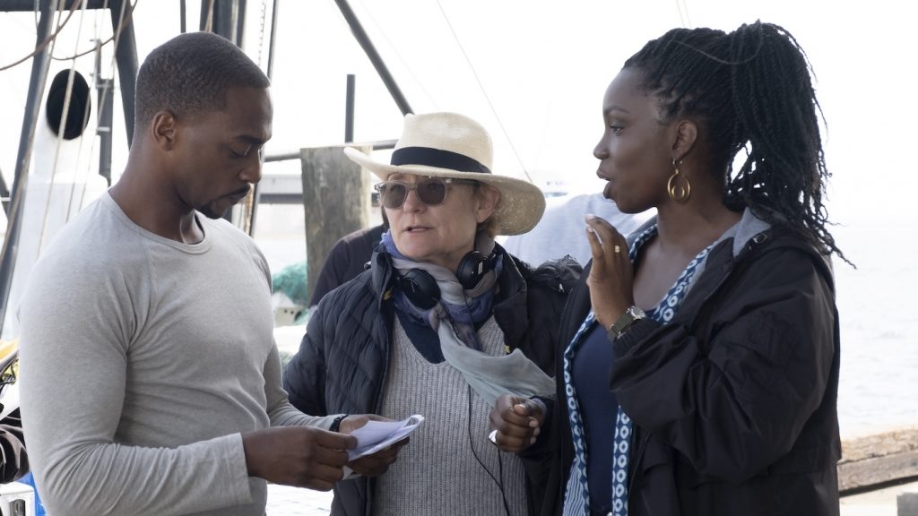 L-r: Falcon/Sam Wilson (Anthony Mackie), director Kari Skogland, and Sarah Wilson (Adepero Oduye) on the set of Marvel Studios' The Falcon and the Winter Soldier.' Photo by Chuck Zlotnick. Courtesy Marvel Studios.