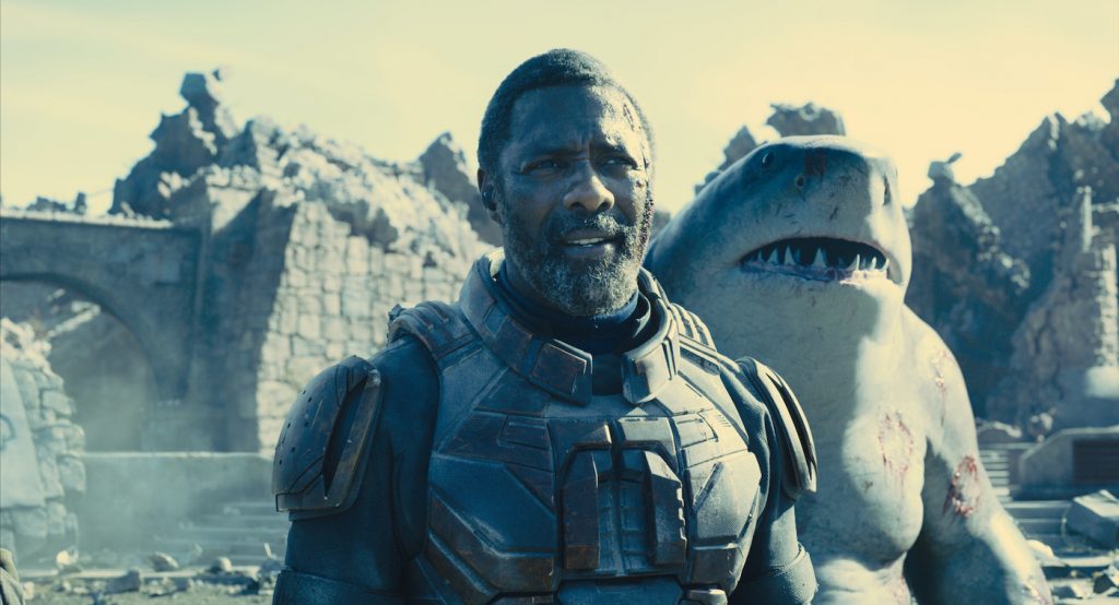 Caption: (L-r) IDRIS ELBA as Bloodsport and KING SHARK in Warner Bros. Pictures’ superhero action adventure “THE SUICIDE SQUAD,” a Warner Bros. Pictures release. Photo Credit: Warner Bros. Pictures/™ & © DC Comics