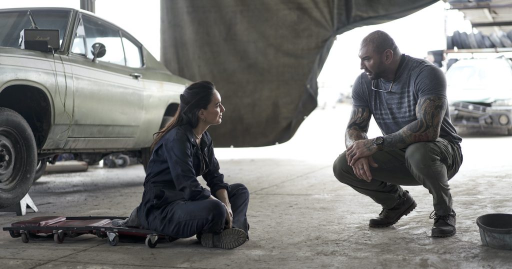 ARMY OF THE DEAD (L to R) ANA DE LA REGUERA as CRUZ and Dave Bautista as Scott Ward in ARMY OF THE DEAD. Cr. CLAY ENOS/NETFLIX © 2021