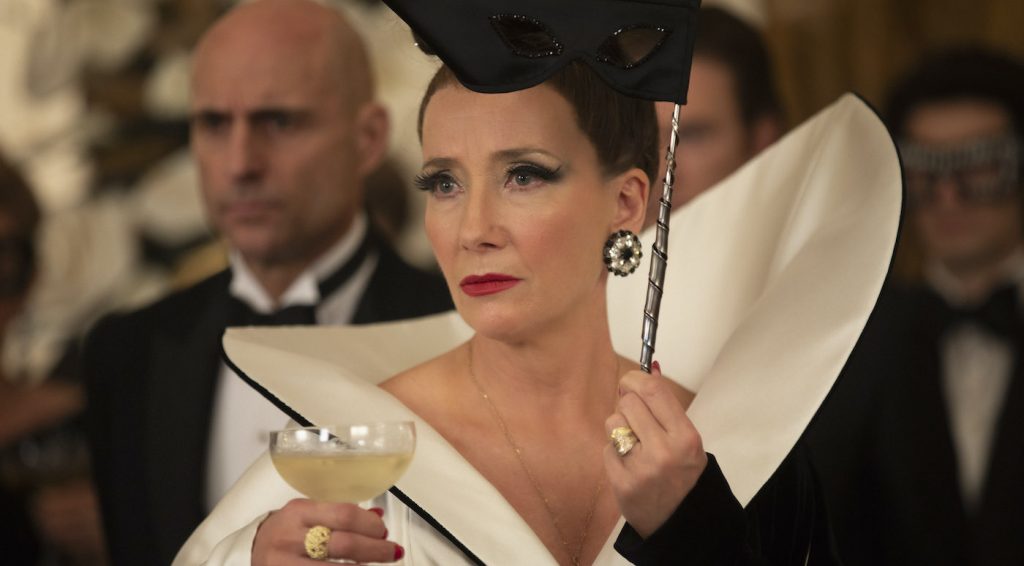 (L-R): Mark Strong as John the Valet and Emma Thompson as the Baroness in Disney’s live-action CRUELLA. Photo by Laurie Sparham. © 2021 Disney Enterprises, Inc. All Rights Reserved.