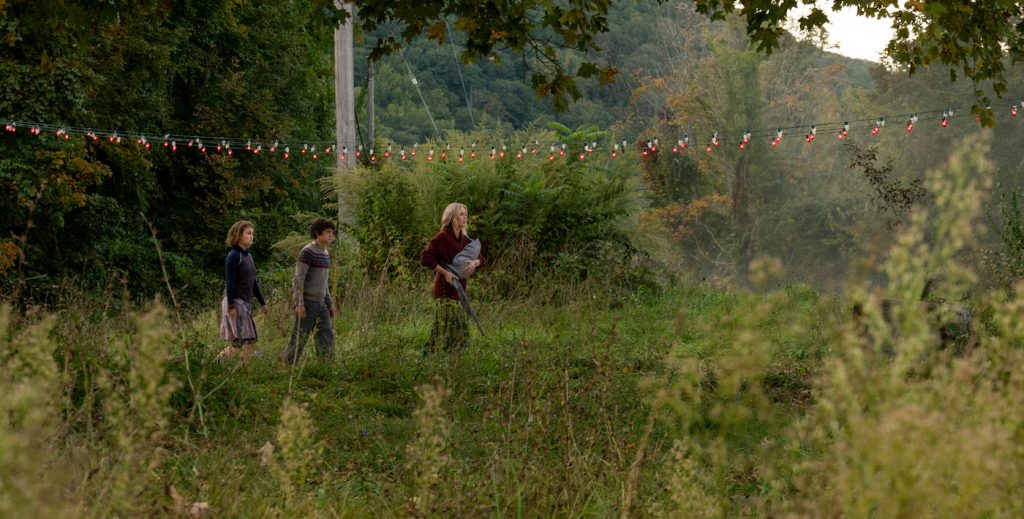 L-r, Regan (Millicent Simmonds), Marcus (Noah Jupe) and Evelyn (Emily Blunt) brave the unknown in "A Quiet Place Part II.” Photo by Jonny Cournoyer. Courtesy Paramount Pictures.