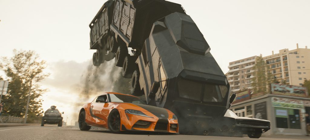 Han’s Toyota Supra (left) and Dom's Dodge Charger (right) attempt to stop the monstrous three-section armored vehicle dubbed the Armadillo in F9, co-written and directed by Justin Lin.