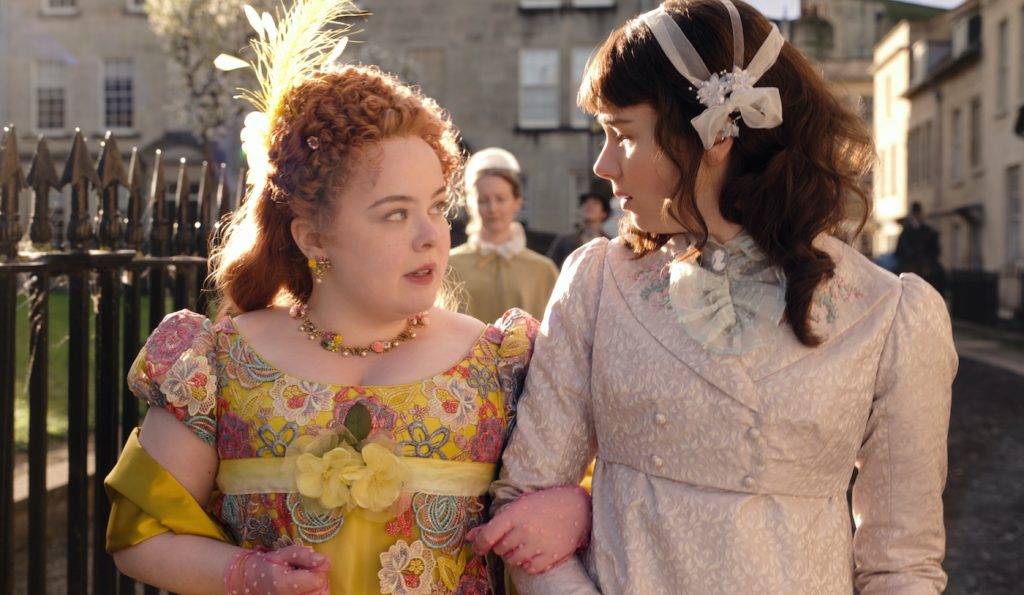 BRIDGERTON (L to R) NICOLA COUGHLAN as PENELOPE FEATHERINGTON and CLAUDIA JESSIE as ELOISE BRIDGERTON in episode 102 of BRIDGERTON Cr. COURTESY OF NETFLIX/NETFLIX © 2020