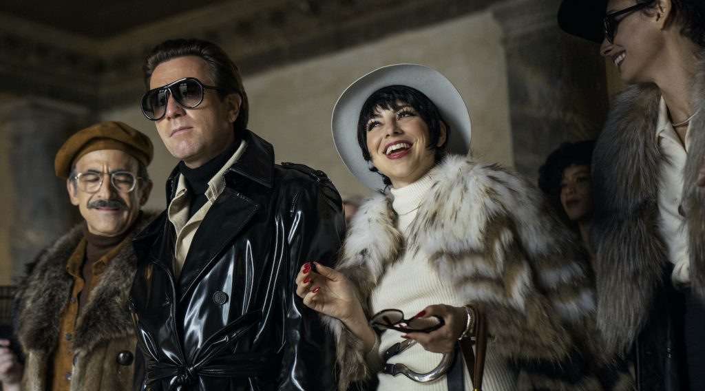 HALSTON (L to R) DAVID PITTU as JOE EULA, EWAN MCGREGOR as HALSTON, KRYSTA RODRIGUEZ as LIZA MINNELLI, and REBECCA DAYAN as ELSA PERETTI in episode 102 of HALSTON Cr. ATSUSHI NISHIJIMA/NETFLIX © 2021