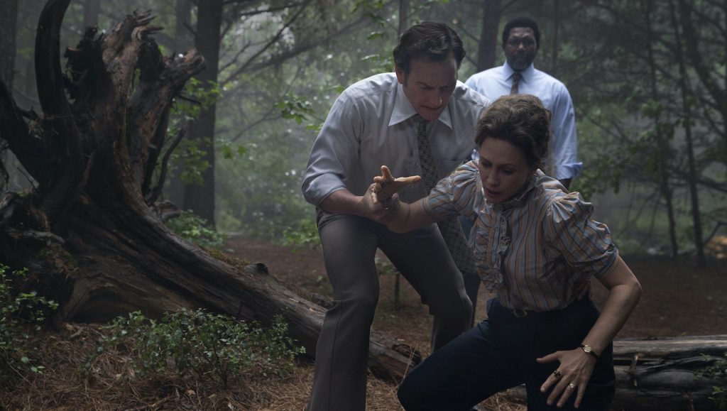 Caption: (L-r) VERA FARMIGA as Lorraine Warren, PATRICK WILSON as Ed Warren and KEITH ARTHUR BOLDEN as Sgt. Clay in New Line Cinema’s horror film “THE CONJURING: THE DEVIL MADE ME DO IT,” a Warner Bros. Pictures release. Photo Credit: Ben Rothstein