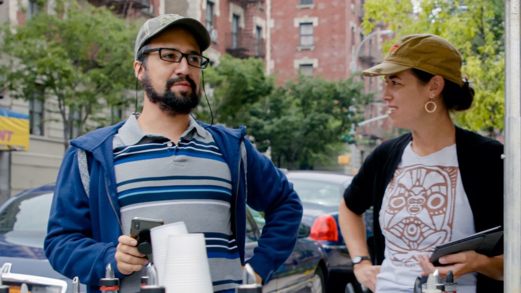 Caption: (L-r) Concept/music & lyrics/producer LIN-MANUEL MIRANDA and QUIARA ALEGRÍA HUDES on the set of Warner Bros. Pictures’ “IN THE HEIGHTS,” a Warner Bros. Pictures release. Photo Credit: Courtesy of Warner Bros. Pictures