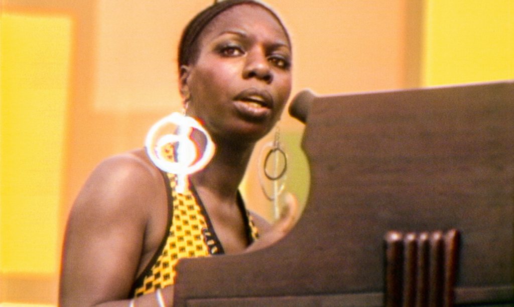 Nina Simone performs at the Harlem Cultural Festival in 1969, featured in the documentary SUMMER OF SOUL. Photo Courtesy of Searchlight Pictures. © 2021 20th Century Studios All Rights Reserved