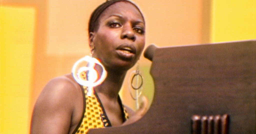 Nina Simone performs at the Harlem Cultural Festival in 1969, featured in the documentary SUMMER OF SOUL. Photo Courtesy of Searchlight Pictures. © 2021 20th Century Studios All Rights Reserved