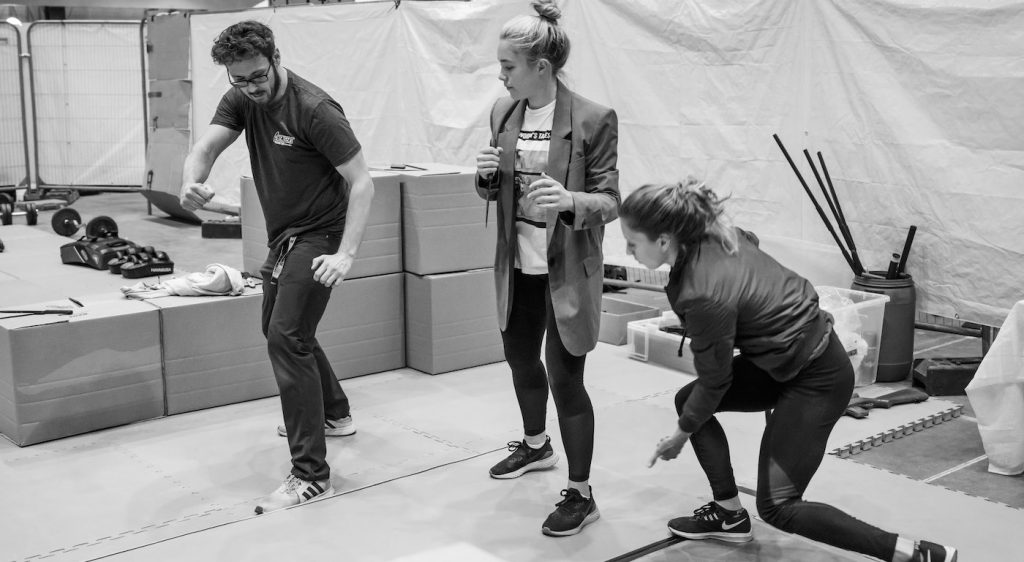 (L-R): Stunt coordinator Rob Inch, Florence Pugh and stunt double on the set of Marvel Studios' BLACK WIDOW, in theaters and on Disney+ with Premier Access. Photo by Jay Maidment. ©Marvel Studios 2021. All Rights Reserved