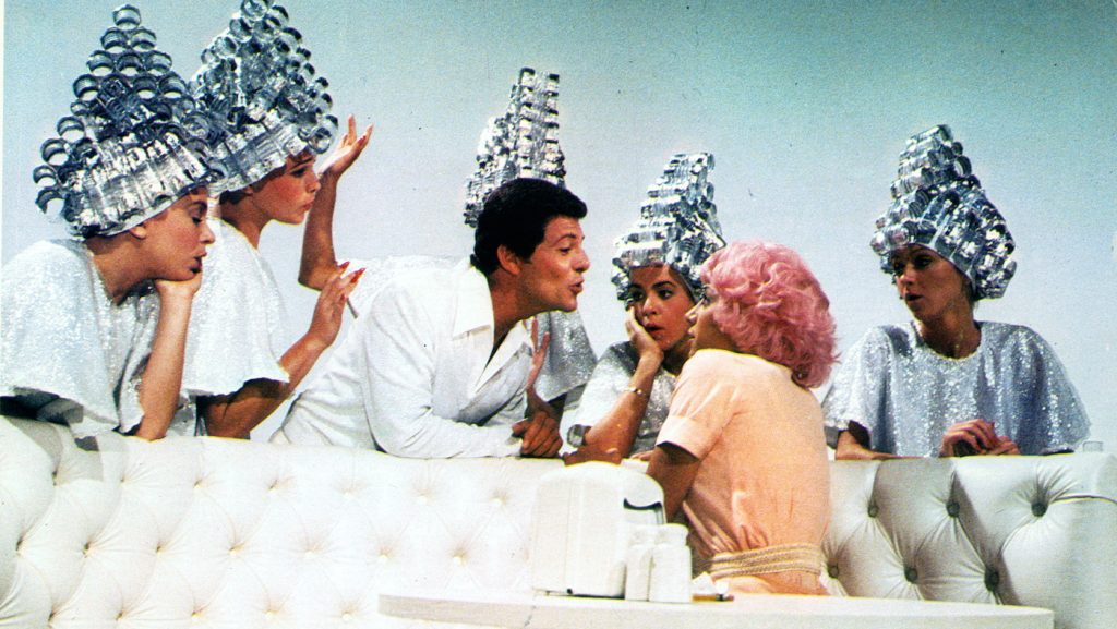 Frankie Avalon and Stockard Channing serenade Didi Conn in a scene from the film 'Grease', 1978. (Photo by Paramount/Getty Images)