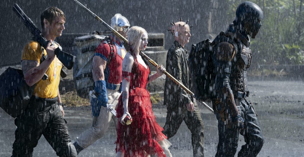 Caption: (L-r) JOEL KINNAMAN as Rick Flag, JOHN CENA as Peacemaker, MARGOT ROBBIE as Harley Quinn, PETER CAPALDI as The Thinker and IDRIS ELBA as Bloodsport in Warner Bros. Pictures’ action adventure “THE SUICIDE SQUAD,” a Warner Bros. Pictures release. Photo Credit: Jessica Miglio/™ & © DC Comics