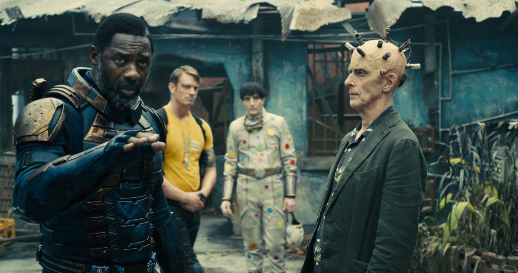 Caption: (L-r) IDRIS ELBA as Bloodsport, JOEL KINNAMAN as Colonel Rich Flag, DAVID DASTMALCHIAN as Polka-Dot Man and PETER CAPALDI as Thinker in Warner Bros. Pictures’ superhero action adventure “THE SUICIDE SQUAD,” a Warner Bros. Pictures release. Photo Credit: Courtesy of Warner Bros. Pictures/™ & © DC Comics