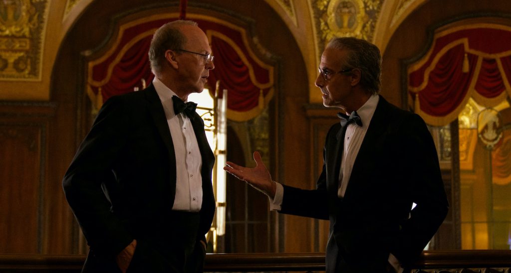 WORTH (2021), Michael Keaton as Kenneth Feinberg and Stanley Tucci as Charles Wolf. Cr Monika Lek / Netflix