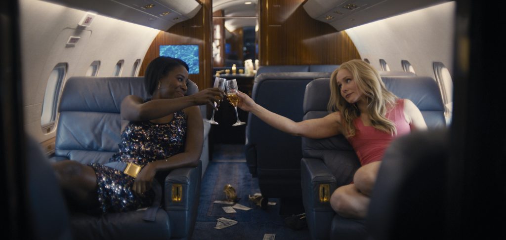 Kirby Howell-Baptiste as JoJo Johnson and Kristen Bell as Connie Kaminski in QUEENPINS. Credit: Courtesy STX Films