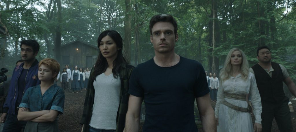 (L-R): Karun (Harish Patel), Kingo (Kumail Nanjiani), Sprite (Lia McHugh), Sersi (Gemma Chan), Ikaris (Richard Madden), Thena (Angelina Jolie), Gilgamesh (Don Lee) in Marvel Studios' ETERNALS. Photo courtesy of Marvel Studios. ©Marvel Studios 2021. All Rights Reserved.