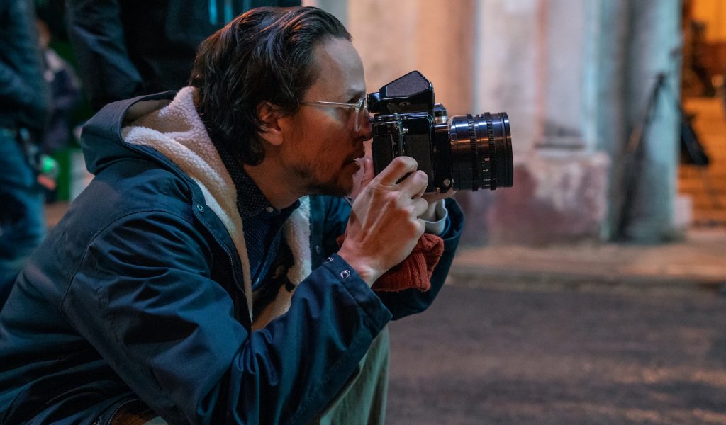 Director Cary Joji Fukunaga on the set of NO TIME TO DIE, an EON Productions and Metro-Goldwyn-Mayer Studios film Credit: Nicola Dove © 2021 DANJAQ, LLC AND MGM. ALL RIGHTS RESERVED.