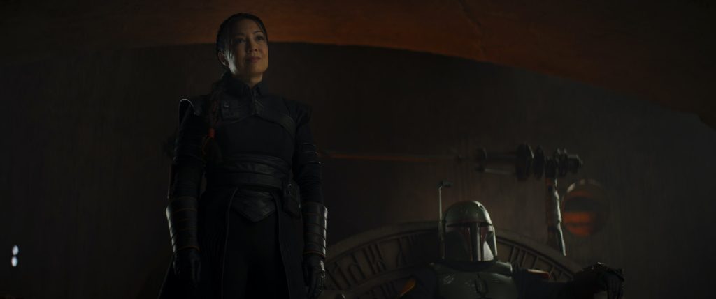 (L-R): Fennec Shand (Ming-Na Wen) and Boba Fett (Temura Morrison) in Lucasfilm's THE BOOK OF BOBA FETT, exclusively on Disney+. © 2021 Lucasfilm Ltd. & ™. All Rights Reserved.