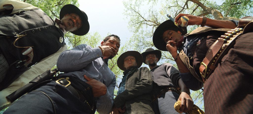 THE HARDER THEY FALL (L to R): DELROY LINDO as BASS REEVES, JONATHAN MAJORS as NAT LOVE, DANIELLE DEADWYLER as CUFFEE, EDI GATHEGI as BILL PICKETT, and RJ CYLER as JIM BECKWOURTH in THE HARDER THEY FALL Cr. COURTESY OF NETFLIX © 2021