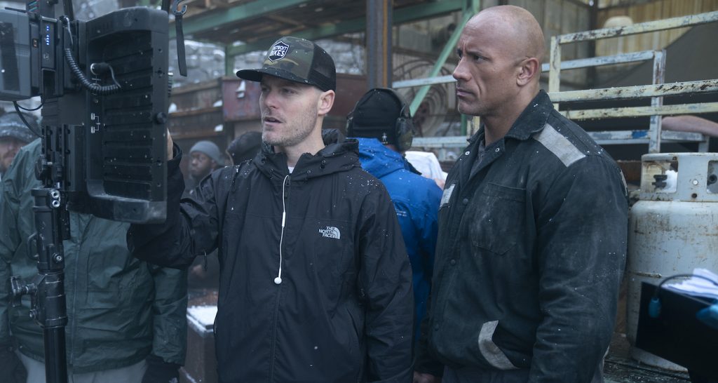 Red Notice. (L to R) Rawson Marshall Thurber (Director) and Dwayne Johnson as John Hartley in Red Notice as seen on February 18, 2020. Cr. Frank Masi/Netflix © 2021