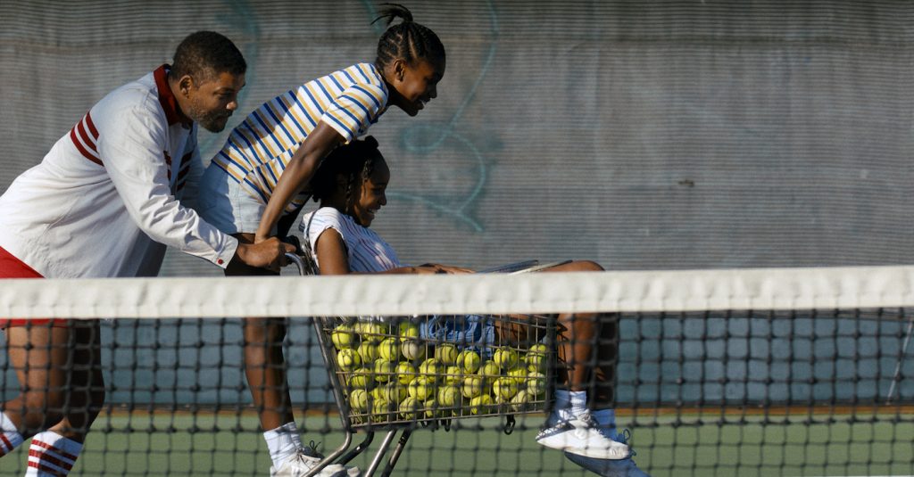 Caption: (L-r) WILL SMITH as Richard Williams, DEMI SINGLETON as Serena Williams and SANIYYA SIDNEY as Venus Williams in Warner Bros. Pictures’ inspiring drama “KING RICHARD,” a Warner Bros. Pictures release. Photo Credit: Courtesy of Warner Bros. Pictur