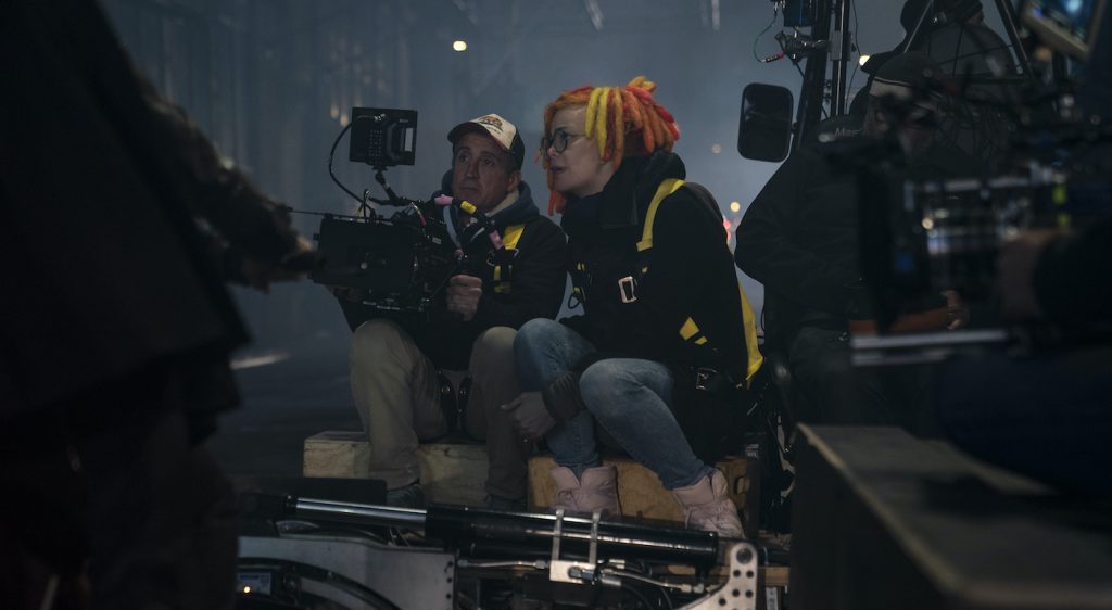 Caption: (L-r) Director of photography DANIELE MASSACCESI and director/co-writer/producer LANA WACHOWSKI on the set of Warner Bros. Pictures, Village Roadshow Pictures and Venus Castina Productions’ “THE MATRIX RESURRECTIONS,” a Warner Bros. Pictures release. Photo Credit: Murray Close