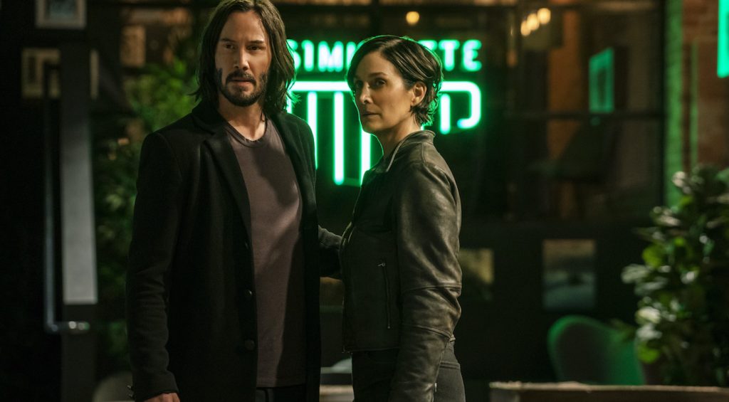 Caption: (L-r) KEANU REEVES as Neo/Thomas Anderson and CARRIE-ANNE MOSS as Trinity in Warner Bros. Pictures, Village Roadshow Pictures and Venus Castina Productions’ “THE MATRIX RESURRECTIONS,” a Warner Bros. Pictures release. Photo Credit: Murray Close