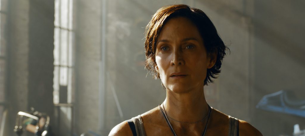 Caption: CARRIE-ANNE MOSS as Trinity in Warner Bros. Pictures, Village Roadshow Pictures and Venus Castina Productions’ “THE MATRIX RESURRECTIONS,” a Warner Bros. Pictures release. Photo Credit: Courtesy of Warner Bros. Pictures