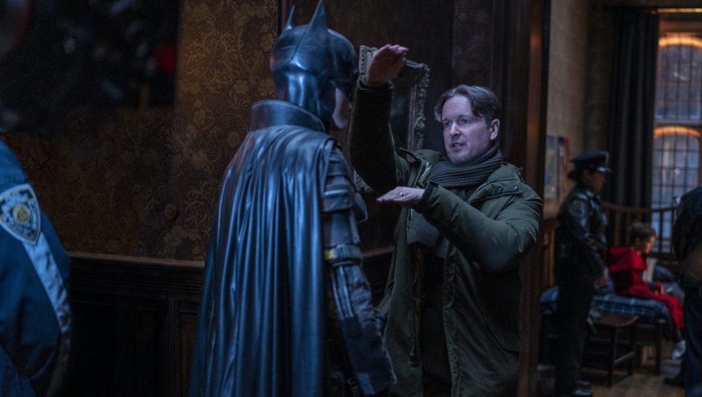 Caption: (L-r) ROBERT PATTINSON and director MATT REEVES and on the set in Warner Bros. Pictures’ action adventure “THE BATMAN,” a Warner Bros. Pictures release. Photo Credit: Jonathan Olley/™ & © DC Comics